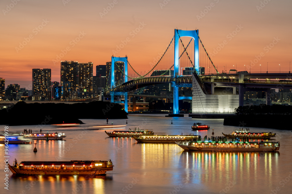 Rainbow bridge at night with yakatabune japanese party boats in tokyo Rainbow bridge at night with yakatabune japanese party boats in tokyo