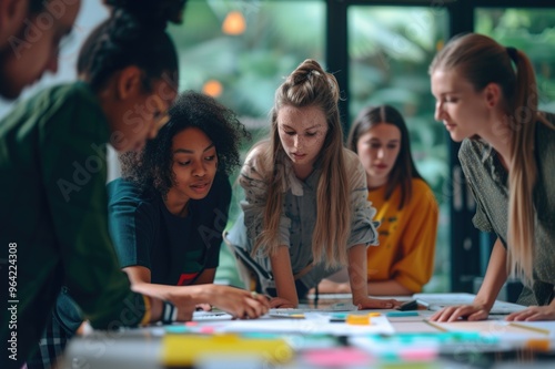 Diverse team collaborating on a project in a modern office