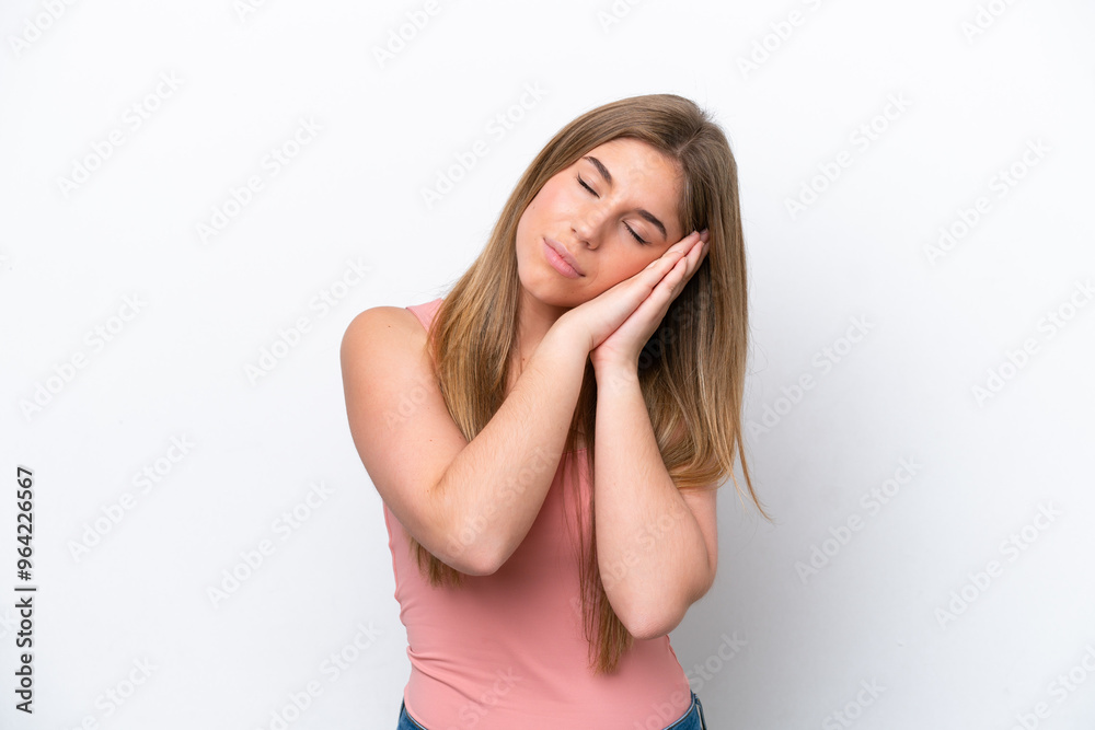 Young caucasian woman isolated on white bakcground making sleep gesture in dorable expression Young caucasian woman isolated on white bakcground making sleep gesture in dorable expression