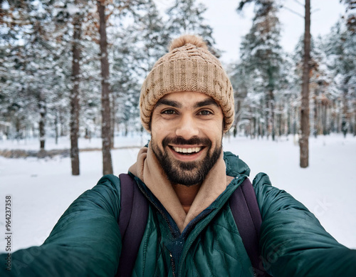 Winter Portrait of Happy Handsome Man Smiling Outdoors