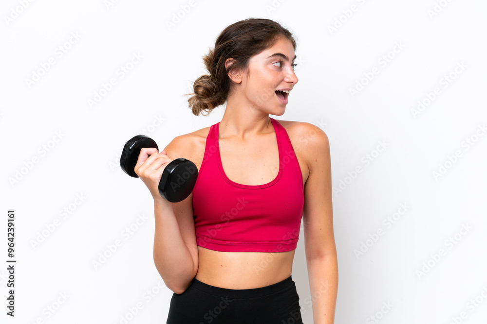 Young sport caucasian woman making weightlifting isolated on white background laughing in lateral position Young sport caucasian woman making weightlifting isolated on white background laughing in lateral position