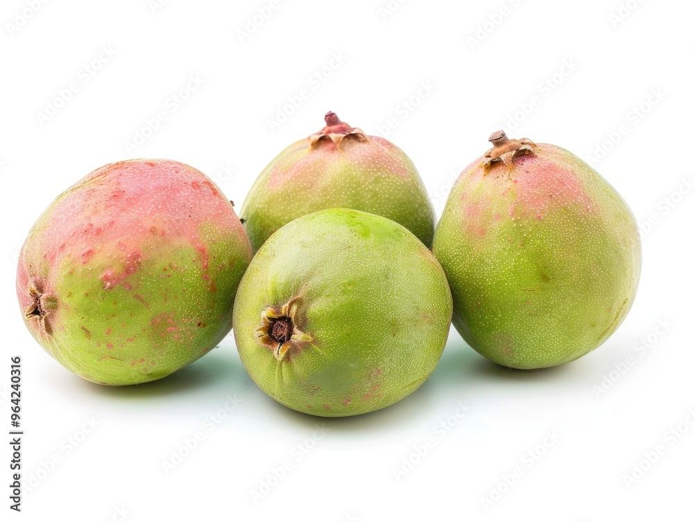 Four green fruits with a red spot on the top. They are ripe and ready to eat. The fruits are placed in a row on a white background Four green fruits with a red spot on the top. They are ripe and ready to eat. The fruits are placed in a row on a white background