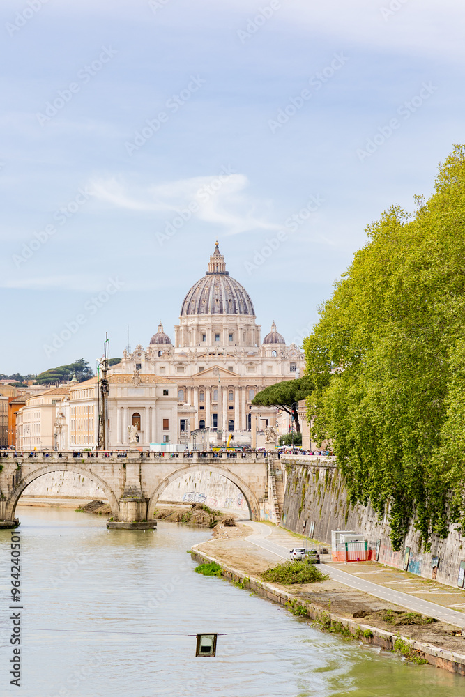 Fototapeta premium Rome, Italy - April 09, 2024: Tiber river in Rome with tourists crowding its surroundings in Rome, Italy