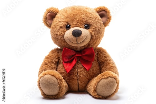 A Smiling Brown Teddy Bear With Button Eyes And A Red Bow Tie Is Sitting On A White Background, Looking At The Camera.