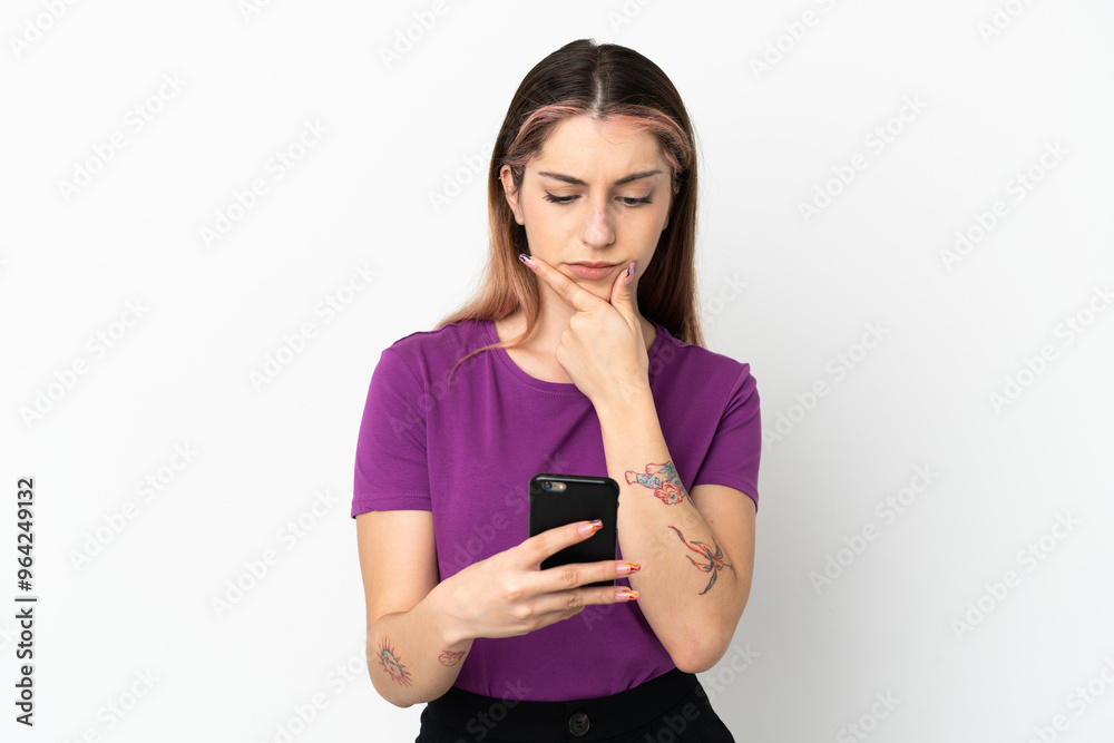 Young caucasian woman isolated on white background thinking and sending a message Young caucasian woman isolated on white background thinking and sending a message