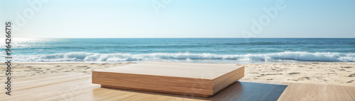 Wooden rectangular podium on sandy beach with ocean waves and clear blue sky in backdrop. Product display background with copy space.