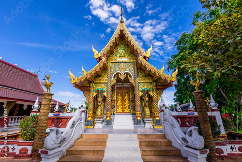 Background of a beautiful old church, Wat Phra Bat Thung Or, San Pa Tong area, Chiang Mai province, has beautiful sculptures. photo