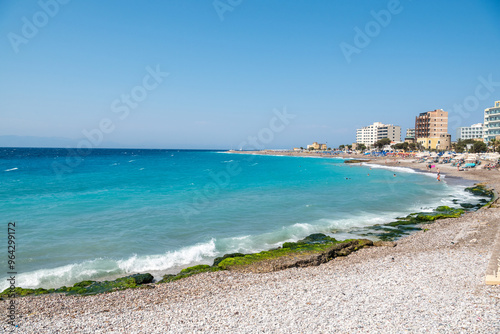 Fototapeta Naklejka Na Ścianę i Meble -  Elli Beach in Rhodes Town, Greece. View with unidentifiable figures of people.
