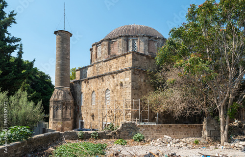 Recep Pasha Mosque, a historical Ottoman mosque on the island of Rhodes, Greece. View of an abandoned mosque, with a collapsed minaret. Located in Dorieos square photo