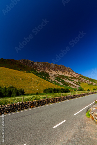 Summer day, cliffs and scree, mountain side, extreme wide angle. photo