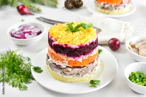 Layered salad with beet, herring, carrots and potatoes