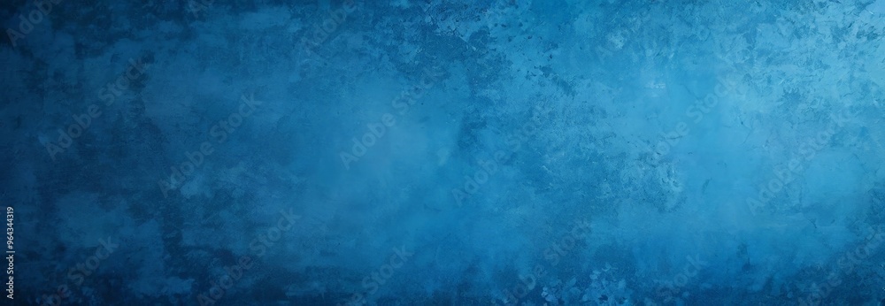 Fototapeta premium a textured blue background with a gradient effect, resembling a marble or stone surface.