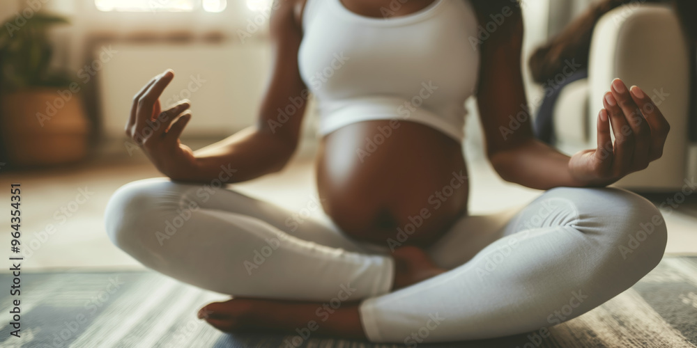 Pregnant Woman Practicing Yoga Meditation at Home in Comfortable White Attire Pregnant Woman Practicing Yoga Meditation at Home in Comfortable White Attire