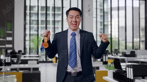 Wallpaper Mural Asian Business Man In A Suit And Tie Looking At A Gold Medal Then Screaming Goal Celebrating Winning As The First Winner In Office Torontodigital.ca