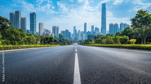 Asphalt Road Leading to City Skyline