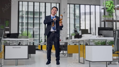 Wallpaper Mural Full Body Of Asian Business Man In A Suit And Tie With A Gold Medal Showing Gold Trophy To Camera, Smiling, And Pointing Himself Being Proud Being Winner In Office Torontodigital.ca
