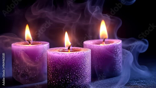 Three purple candles with flames and smoke
