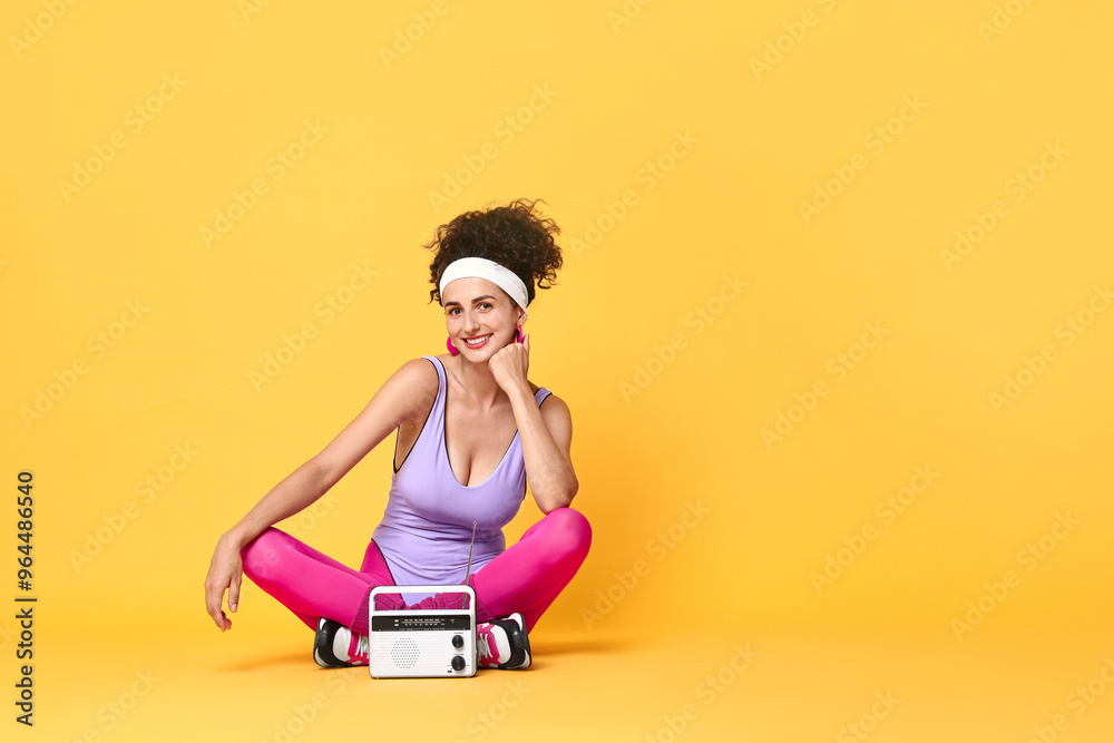 Aerobics. Woman with radio receiver on orange background, space for text