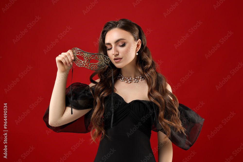 Beautiful woman with carnival mask on red background Beautiful woman with carnival mask on red background