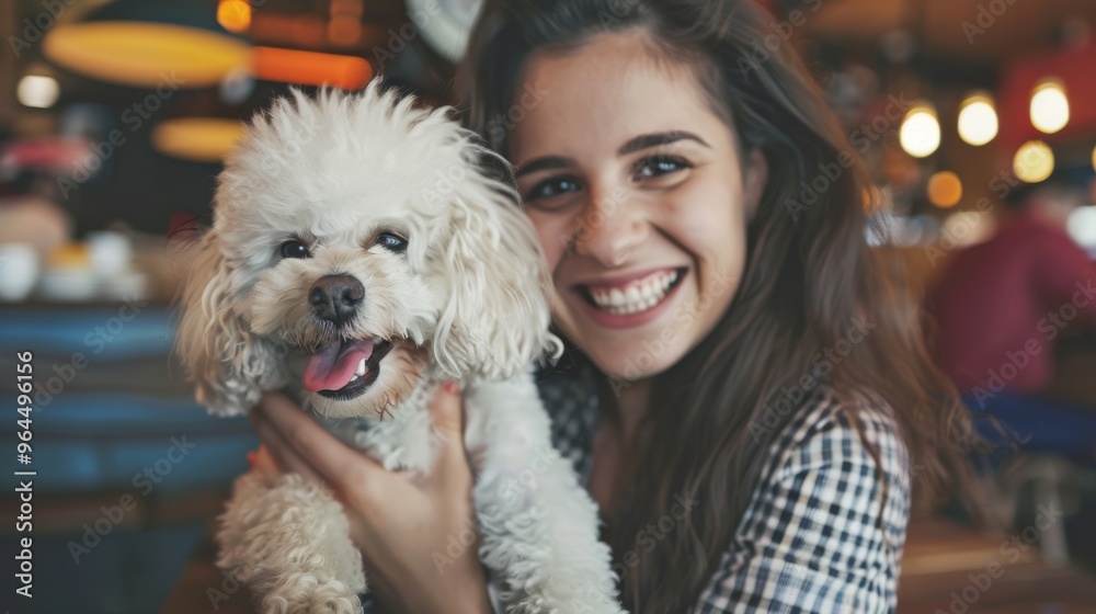 A cheerful woman embraces her fluffy, white dog, both beaming with joy against a cozy café backdrop, capturing a moment of pure affection and happiness. A cheerful woman embraces her fluffy, white dog, both beaming with joy against a cozy café backdrop, capturing a moment of pure affection and happiness.