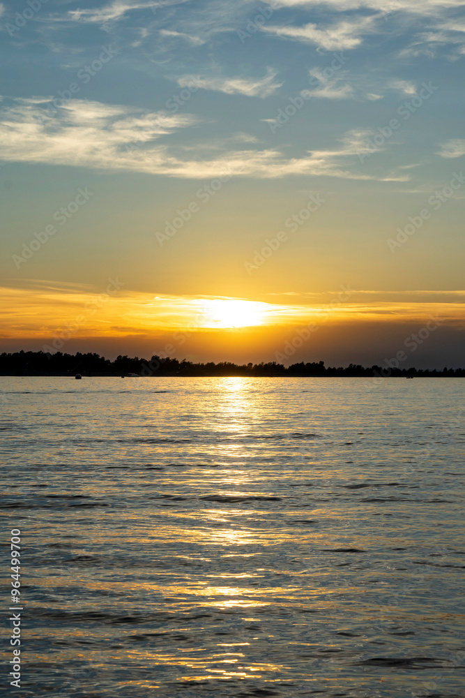 sunset over lake constance ( Bodensee ) with blue sky and clouds but clear sight in hard, vorarlberg, Austria sunset over lake constance ( Bodensee ) with blue sky and clouds but clear sight in hard, vorarlberg, Austria