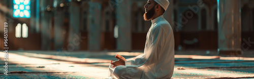 Man Praying in Mosque - Serene Moment of Reflection and Spiritual Connection photo