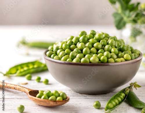 A vibrant display of fresh green peas, both shelled and in pods, suggesting healthy eating and organic produce. photo