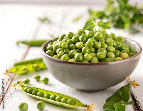 A vibrant display of fresh green peas, both shelled and in pods, suggesting healthy eating and organic produce. photo