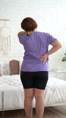 Neck pain, woman suffering from ache at home, health problems concept, vertical video