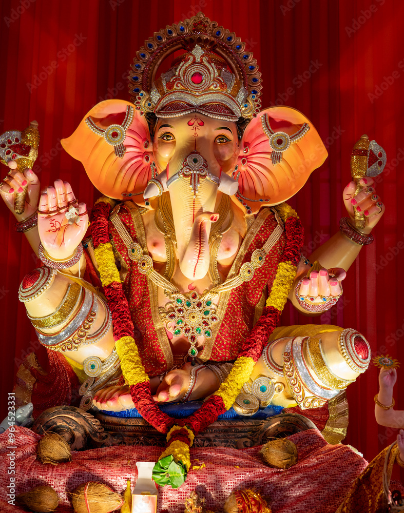 Fototapeta premium A Closeup shot Ganpati Installed in a Pandal during the 10 Day Ganesh Festival, the idols are immersed in heavy water bodies after the 10 days.