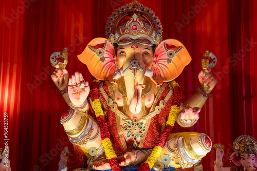 A Closeup shot Ganpati Installed in a Pandal during the 10 Day Ganesh Festival, the idols are immersed in heavy water bodies after the 10 days. photo