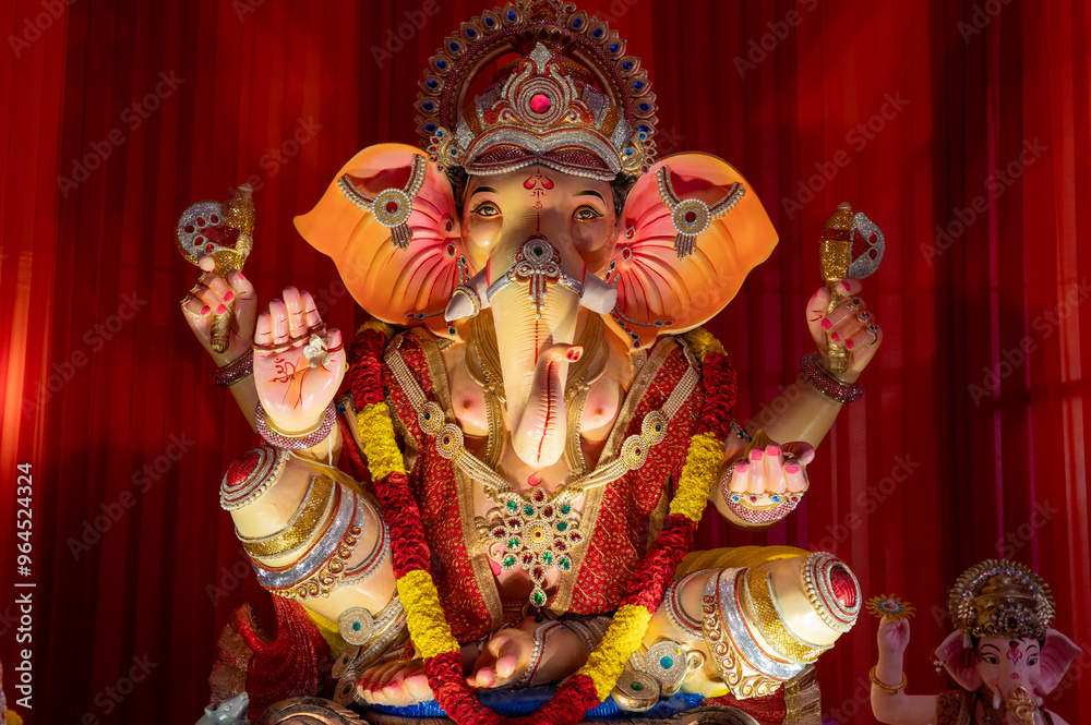 A Closeup shot Ganpati Installed in a Pandal during the 10 Day Ganesh Festival, the idols are immersed in heavy water bodies after the 10 days. A Closeup shot Ganpati Installed in a Pandal during the 10 Day Ganesh Festival, the idols are immersed in heavy water bodies after the 10 days.