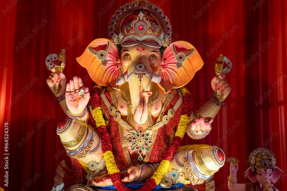 A Closeup shot Ganpati Installed in a Pandal during the 10 Day Ganesh Festival, the idols are immersed in heavy water bodies after the 10 days. A Closeup shot Ganpati Installed in a Pandal during the 10 Day Ganesh Festival, the idols are immersed in heavy water bodies after the 10 days.
