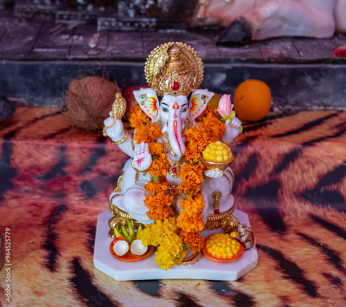 A Closeup shot Ganpati Installed in a Pandal during the 10 Day Ganesh Festival, the idols are immersed in heavy water bodies after the 10 days. photo