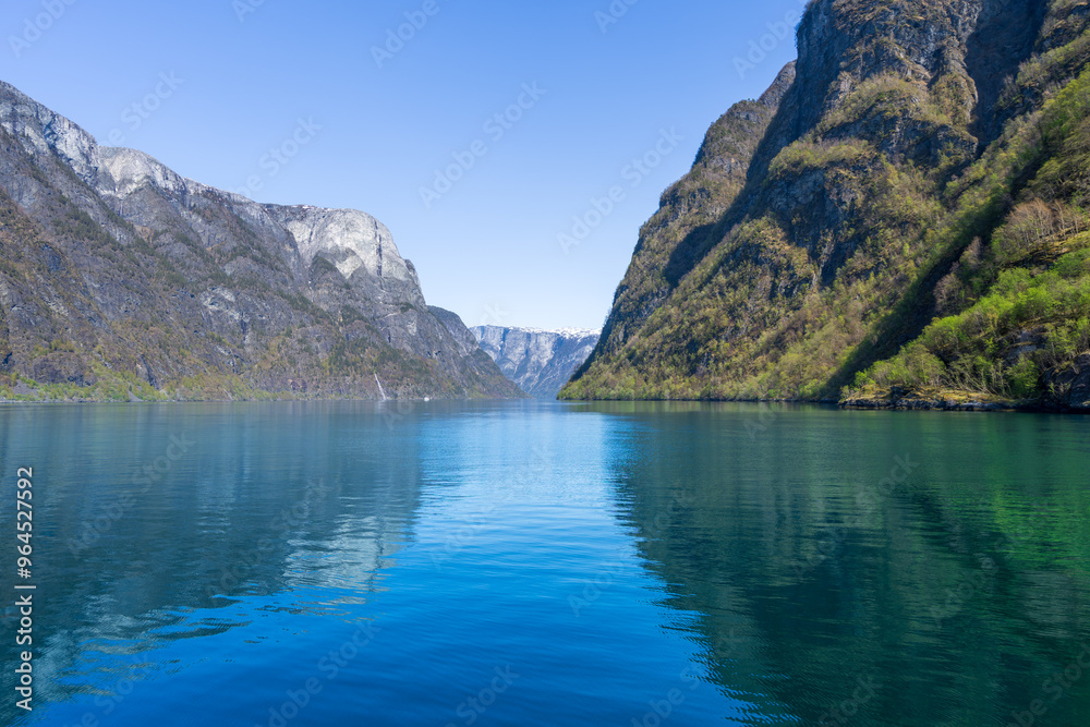 Along the way there are snow-capped mountains, waterfalls and lake reflections. Cruise the World Heritage Sognefjord and enjoy the beautiful scenery. Norway. Along the way there are snow-capped mountains, waterfalls and lake reflections. Cruise the World Heritage Sognefjord and enjoy the beautiful scenery. Norway.