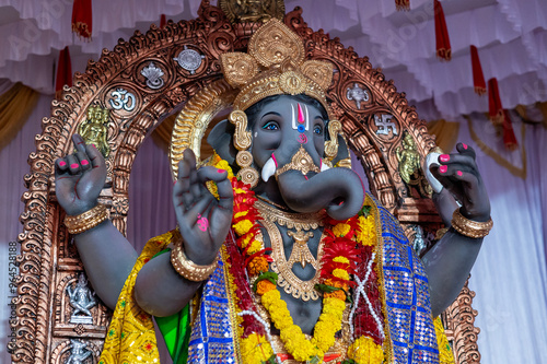 A Closeup shot Ganpati Installed in a Pandal during the 10 Day Ganesh Festival, the idols are immersed in heavy water bodies after the 10 days. photo