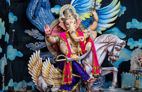 A Closeup shot Ganpati Installed in a Pandal during the 10 Day Ganesh Festival, the idols are immersed in heavy water bodies after the 10 days. photo