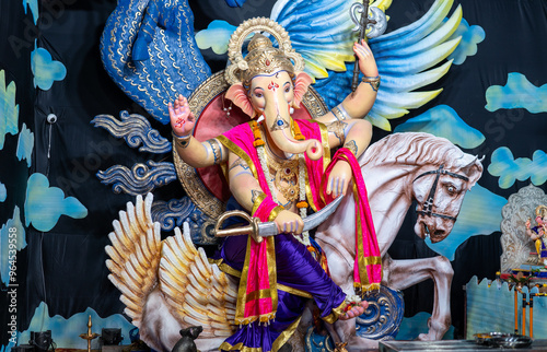 A Closeup shot Ganpati Installed in a Pandal during the 10 Day Ganesh Festival, the idols are immersed in heavy water bodies after the 10 days. photo