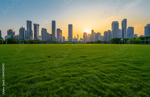 City sunrise and meadow