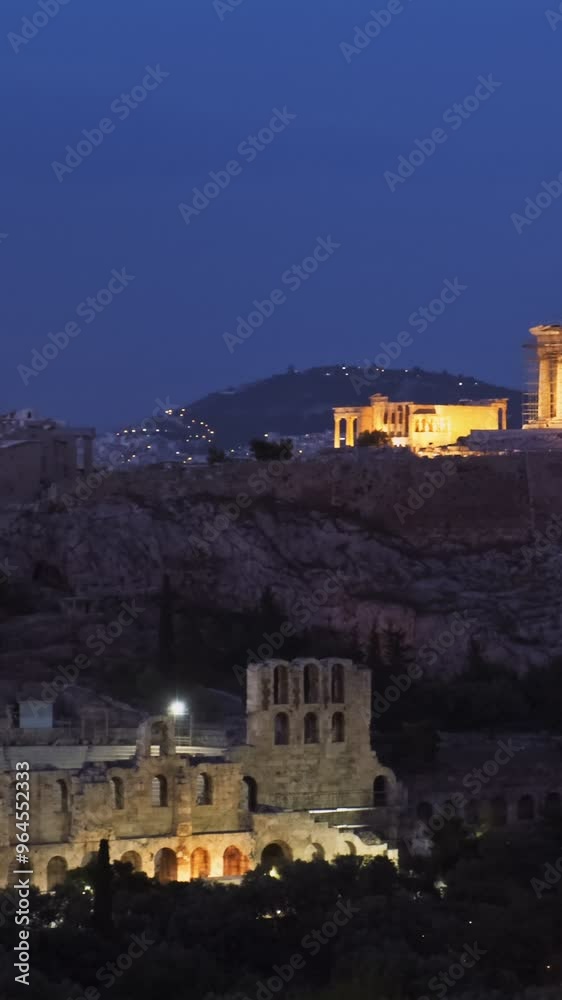 Famous greek tourist landmark - the iconic Parthenon Temple at the Acropolis of Athens as seen from Philopappos Hill in the evening blue hour, Athens, Greece. Horizontal camera pan Famous greek tourist landmark - the iconic Parthenon Temple at the Acropolis of Athens as seen from Philopappos Hill in the evening blue hour, Athens, Greece. Horizontal camera pan