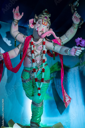 A Closeup shot Ganpati Installed in a Pandal during the 10 Day Ganesh Festival, the idols are immersed in heavy water bodies after the 10 days. photo