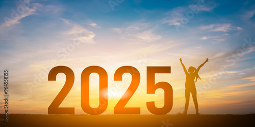 Silhouette of happy woman and 2025 concept in beautiful sunset sky  background.