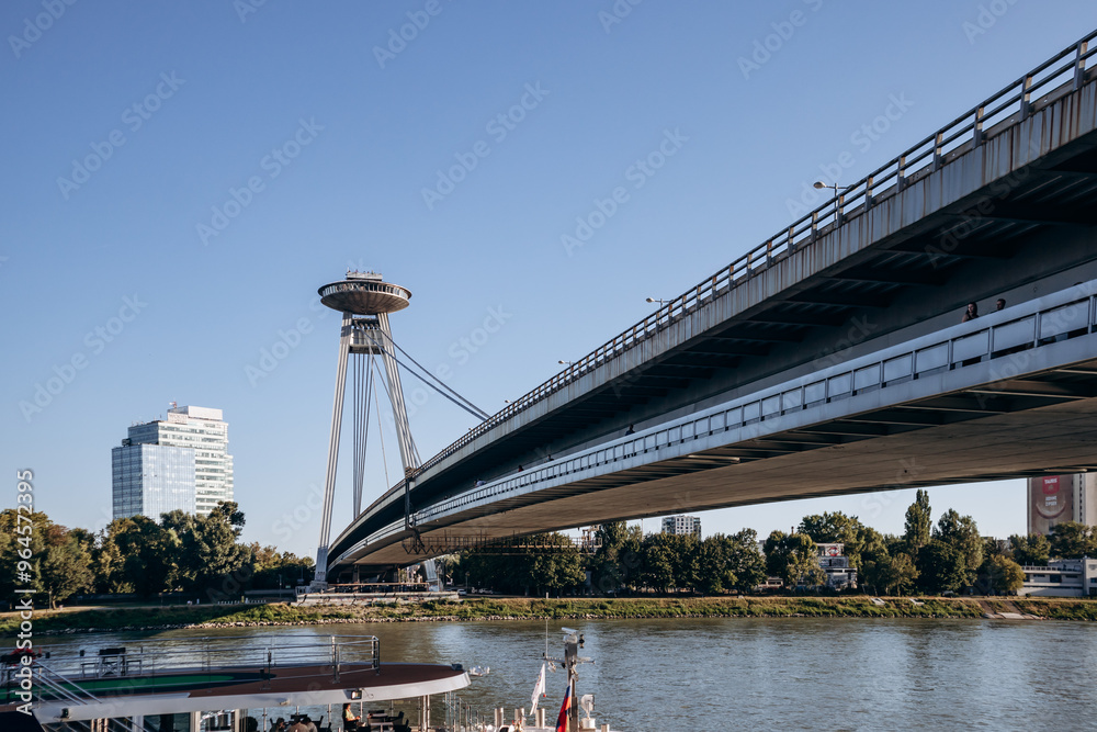 Obraz premium Bratislava, Slovakia - August 7, 2024: The Slovak National Uprising Bridge in Bratislava, also known as Most SNP