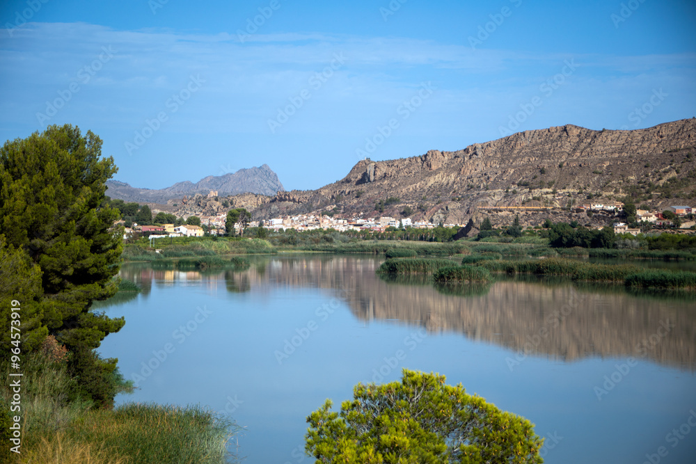 Ojos Reservoir, in the Ricote Valley, Region of Murcia, Spain, with the calm waters reflecting the mountains Ojos Reservoir, in the Ricote Valley, Region of Murcia, Spain, with the calm waters reflecting the mountains