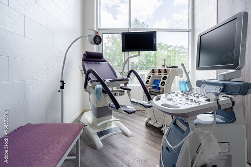 Fotografija Gynecologist's chair and ultrasound machine in a gynecologist clinic