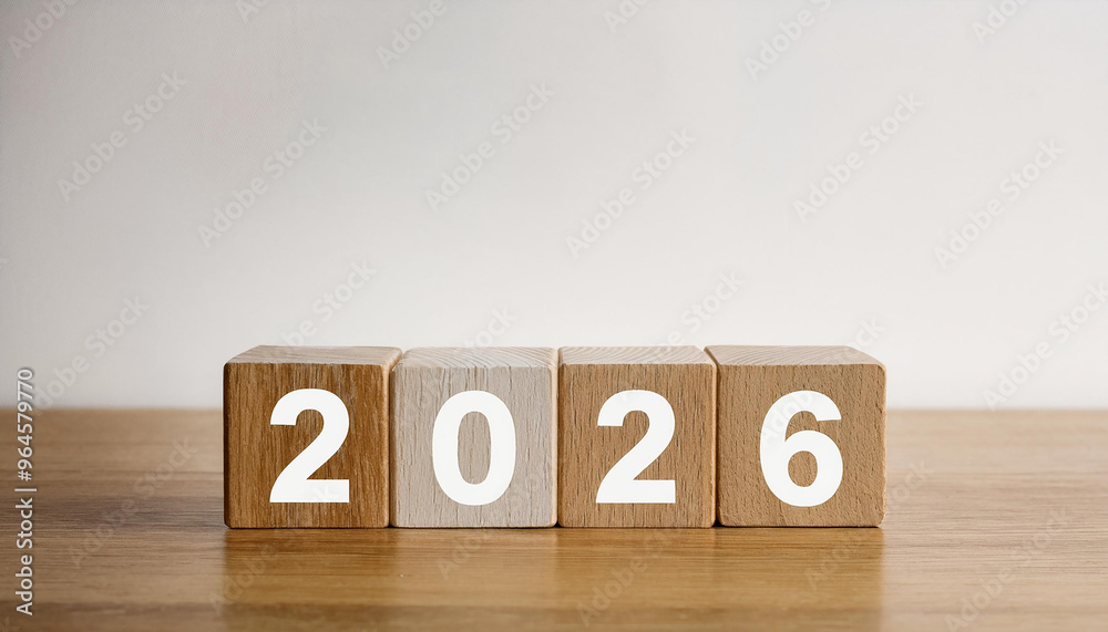 Wooden cubes with number 2026 on wooden table, white wall. New Year. Wooden cubes with number 2026 on wooden table, white wall. New Year.