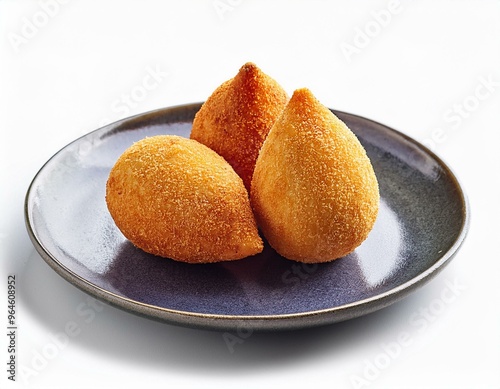 Coxinha on plate isolated on white background photo
