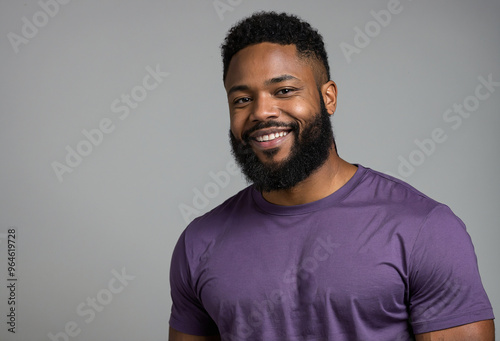 African American smiling man with a beard, dressed casually, posing confidently