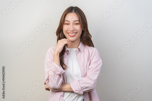 Smile positive, attractive asian young woman wearing casual, portrait girl of beautiful brunette long hair, feeling happy looking at camera, standing cross arms chest isolated on white background