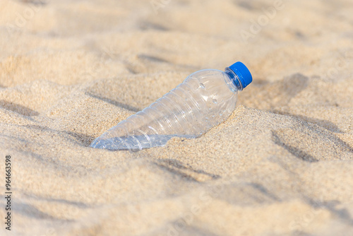 Plastic bottle on the beach left by tourist